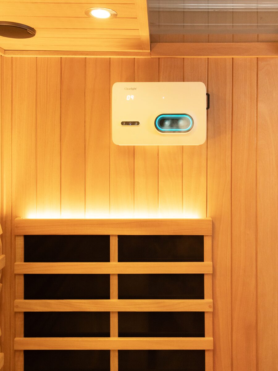 Halo One salt therapy unit mounted on the cedar wall of an infrared sauna